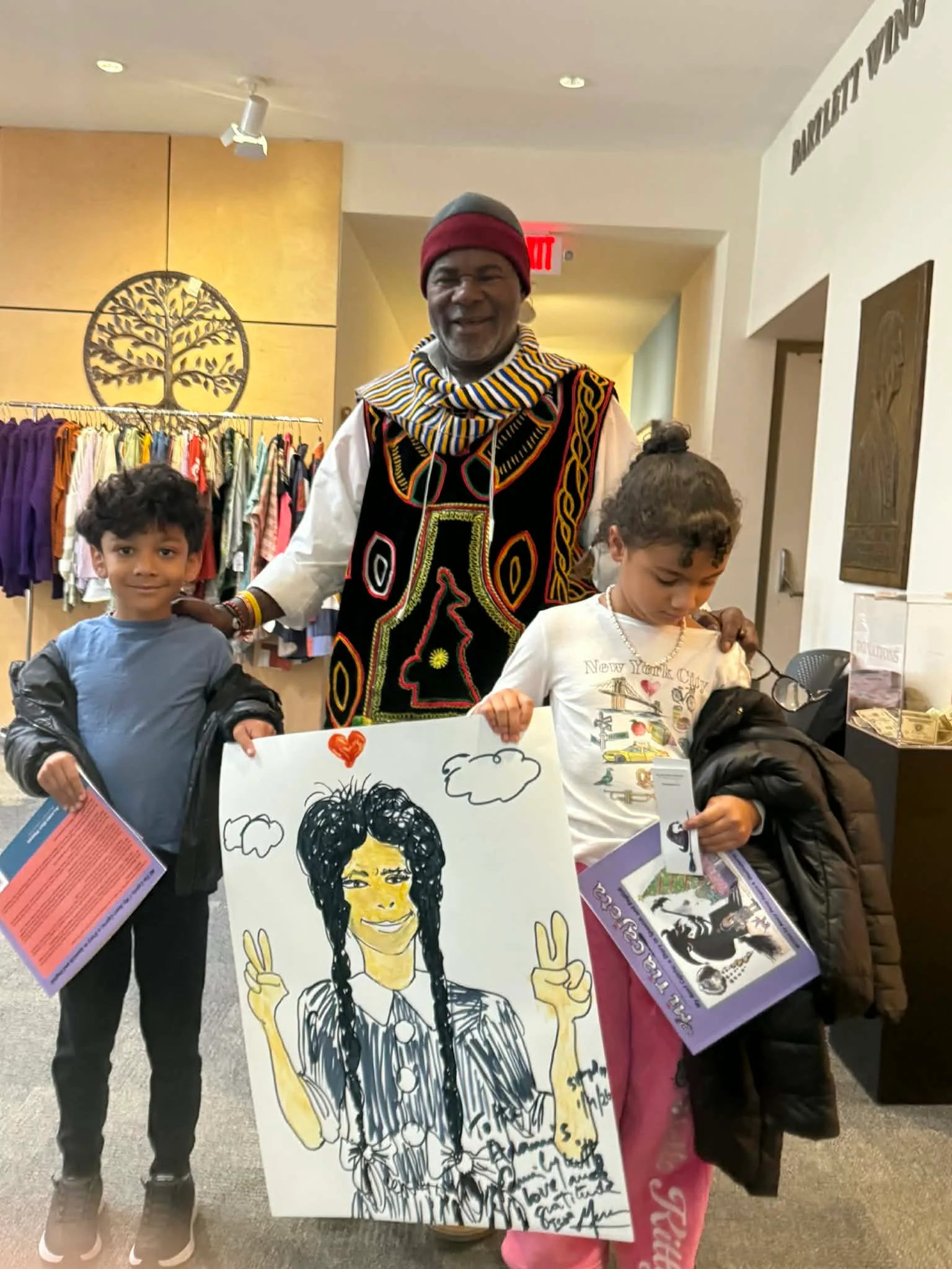 Issa Nyaphaga leading an art workshop for young children