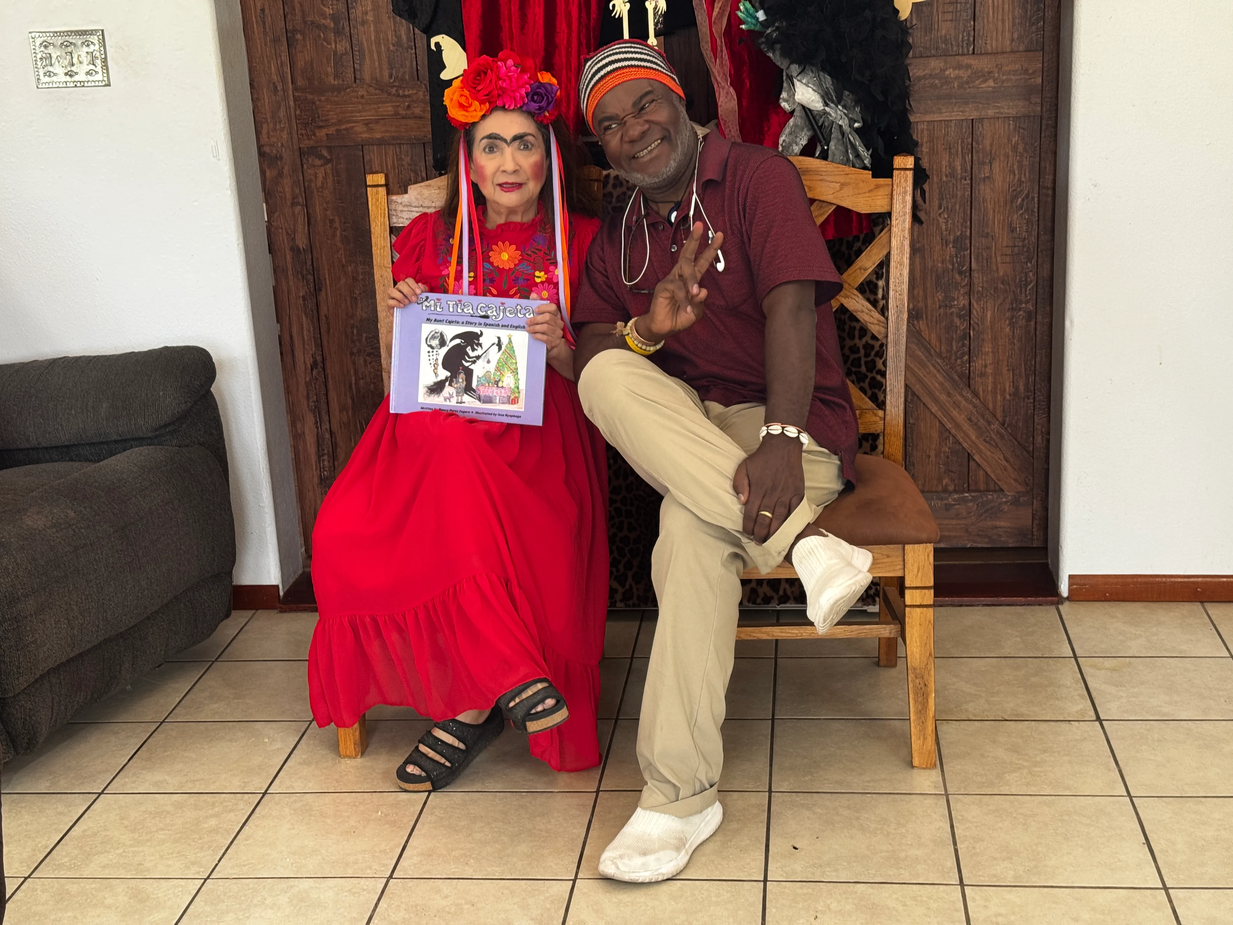 Nancy Perez Fugere and Issa Nyaphaga sharing a joyful moment