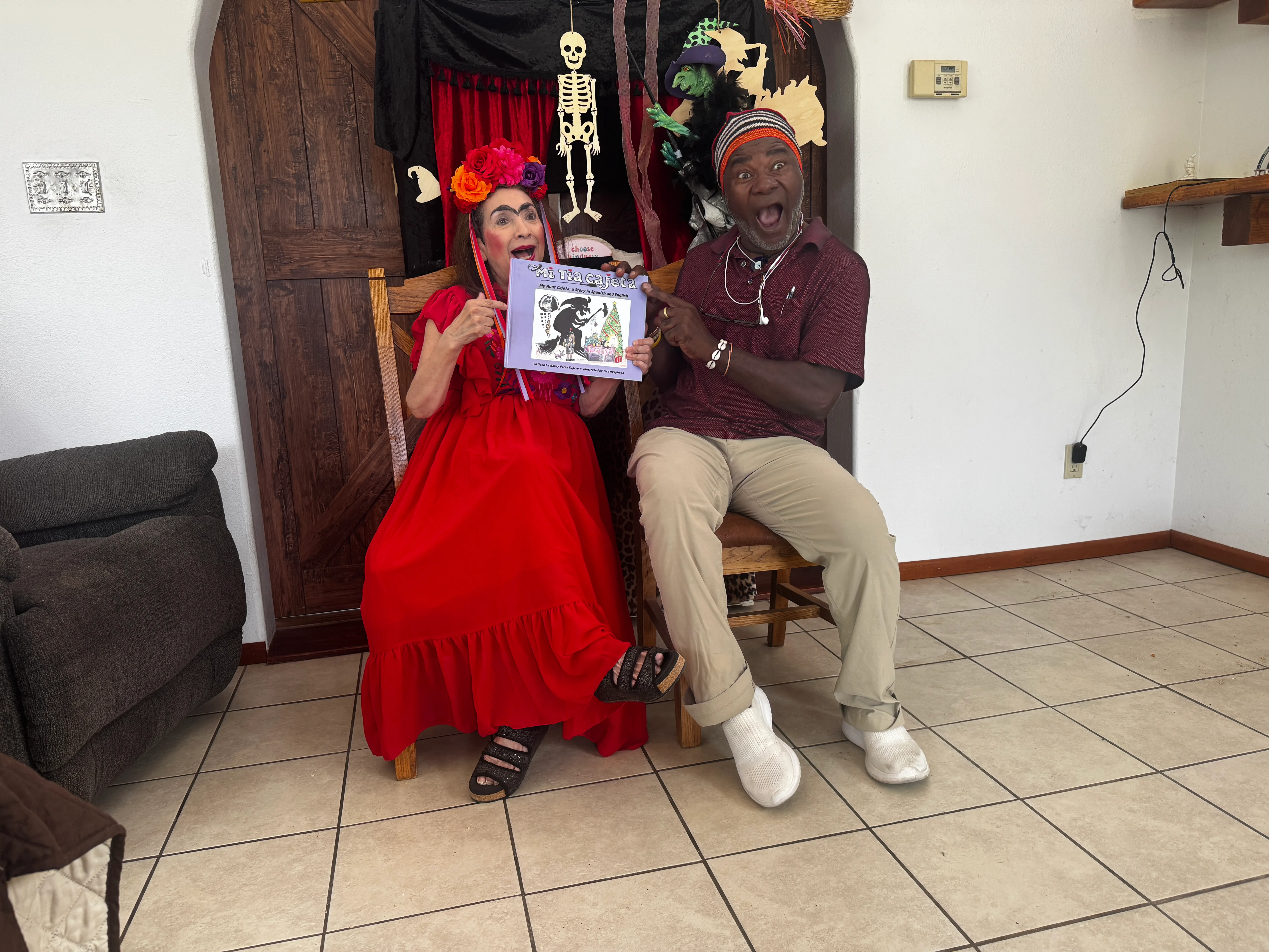 Nancy Perez Fugere and Issa Nyaphaga joyfully presenting the cover of Mi Tía Cajeta